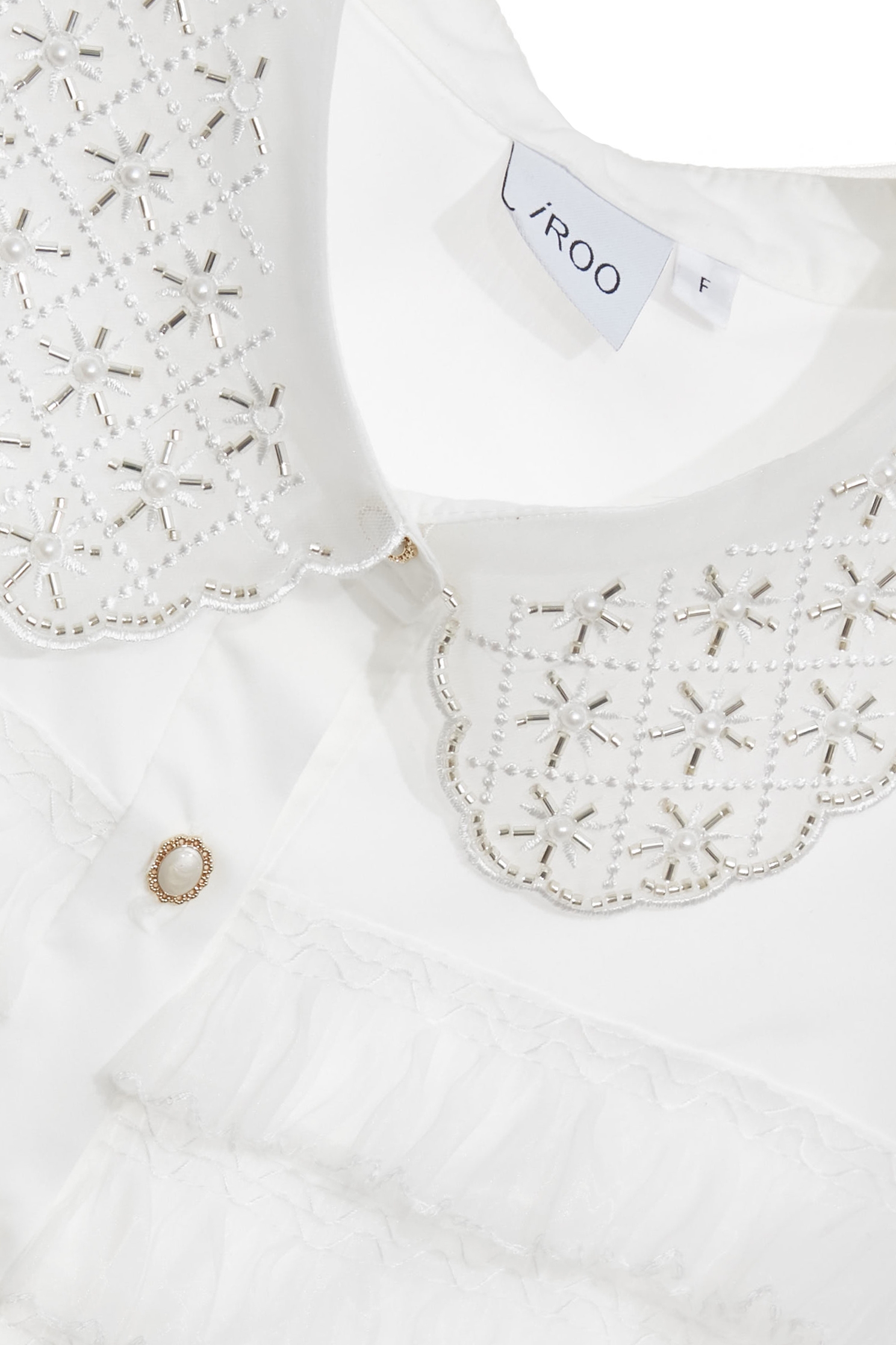 鑲珠飾造型領片荷葉上衣鑲珠飾造型領片荷葉上衣,一般背心,一般背心馬甲,上班OL穿搭,上衣,人氣商品,春夏穿搭,無袖上衣,無袖背心,珍珠,白色背心,約會特輯,背心,荷葉